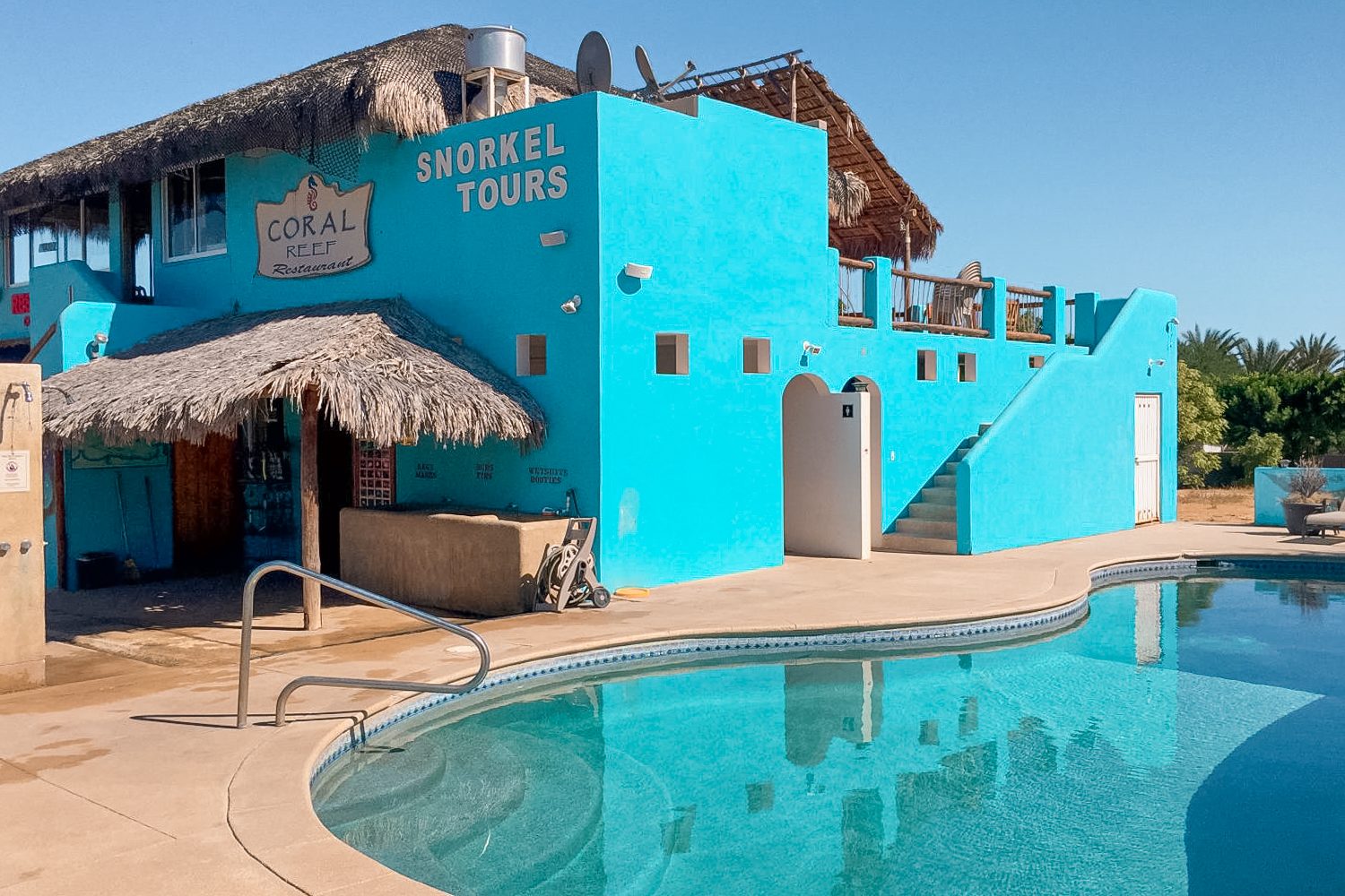 Turquoise pool and Coral Reef building at the resort